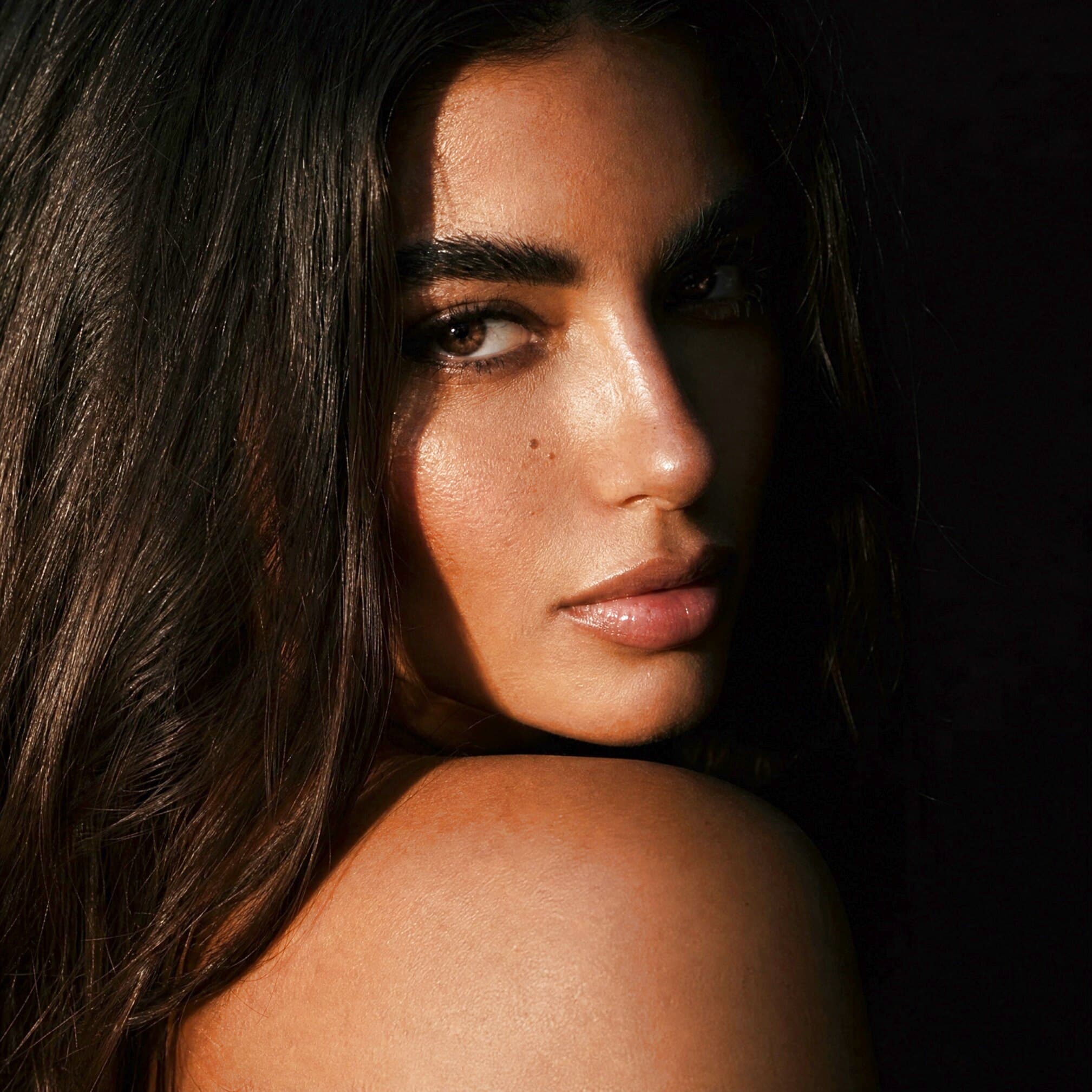 LIV DAHLIA, photographed in shadow